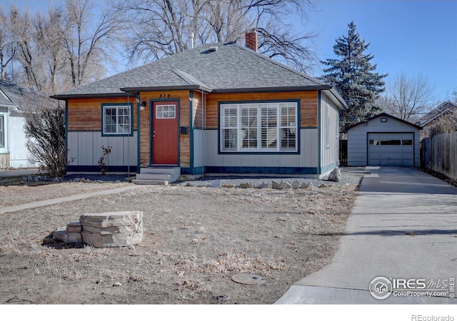 view of front facade featuring an outbuilding and a garage