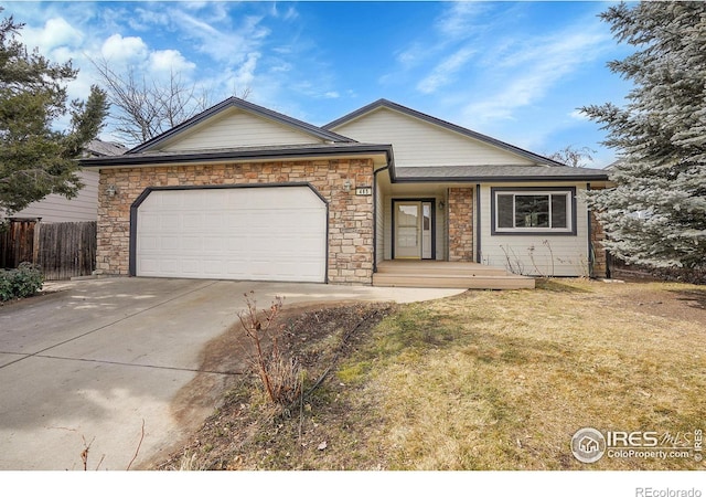 single story home featuring a garage and a front lawn