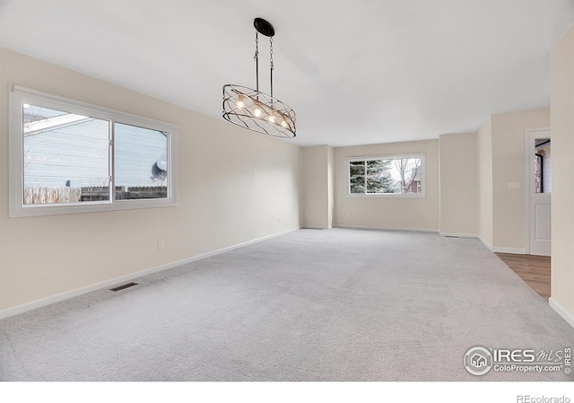 unfurnished room featuring carpet floors
