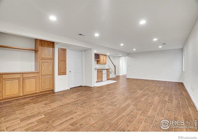 unfurnished living room featuring light wood-type flooring