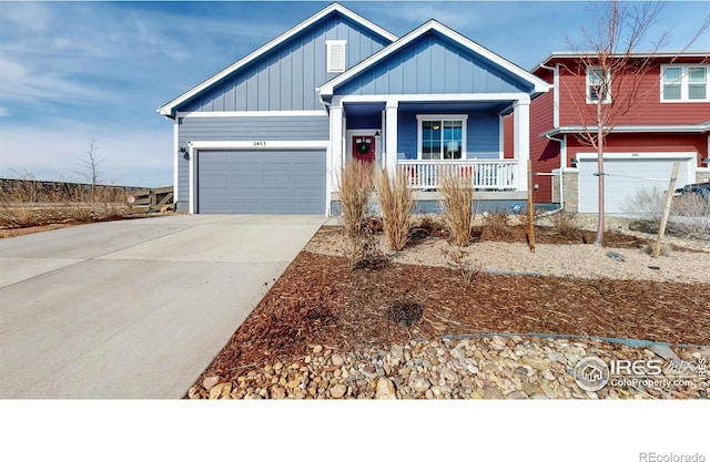 view of front of property featuring a garage, board and batten siding, a porch, and driveway