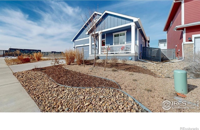 view of front facade featuring covered porch and board and batten siding