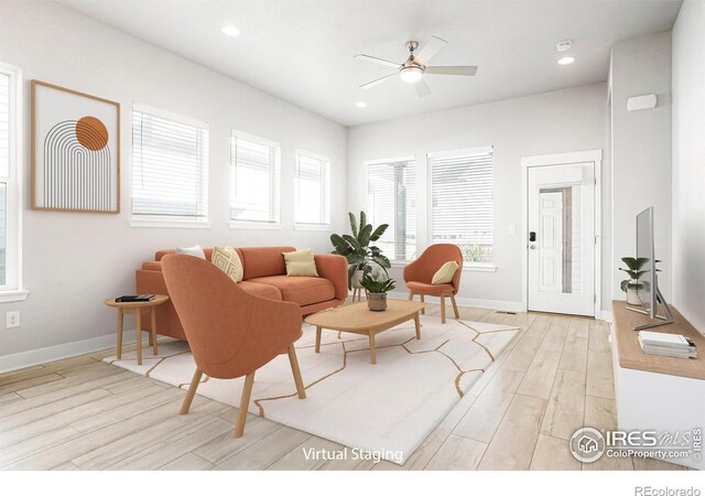 living area featuring light wood-style floors, recessed lighting, ceiling fan, and baseboards