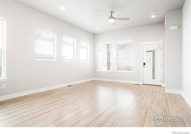 unfurnished room featuring ceiling fan, baseboards, light wood-style flooring, and recessed lighting