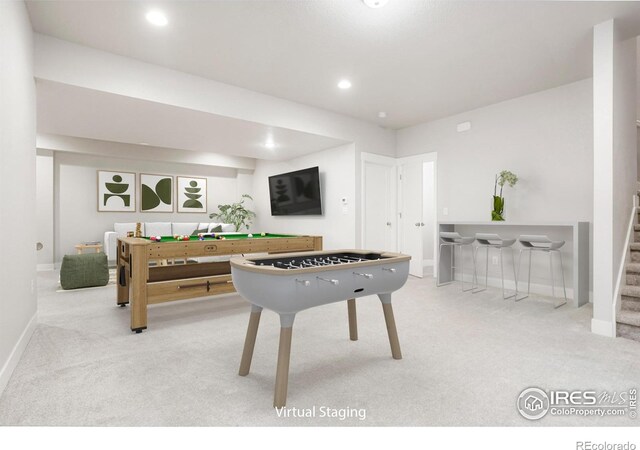 recreation room featuring light carpet, baseboards, and recessed lighting