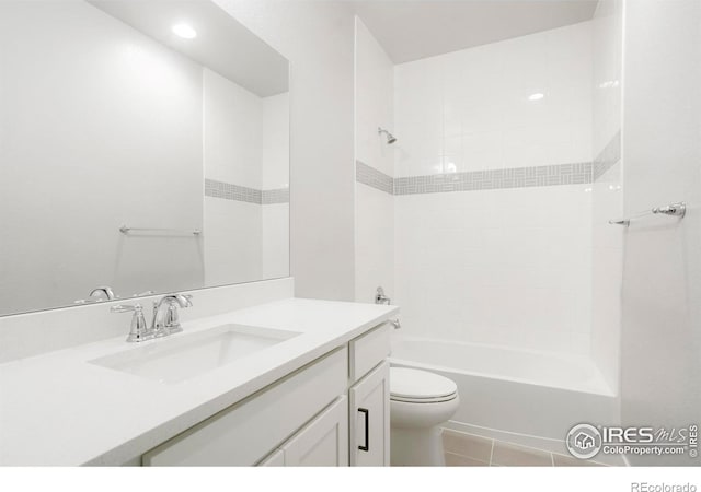 bathroom featuring tile patterned flooring, shower / bath combination, vanity, and toilet