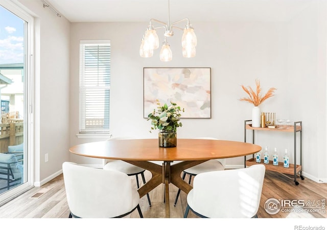 dining area with a healthy amount of sunlight and light wood-type flooring