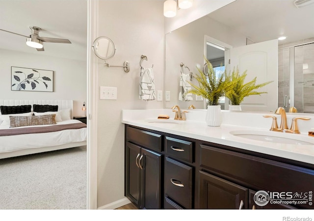 bathroom featuring vanity, ceiling fan, and walk in shower