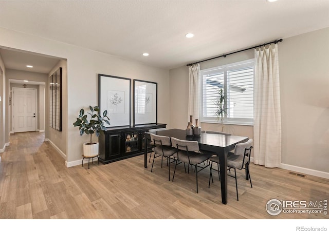 dining area featuring light wood-type flooring