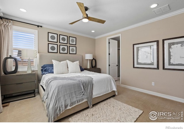 carpeted bedroom featuring ornamental molding and ceiling fan