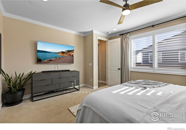 bedroom featuring light colored carpet, ornamental molding, and ceiling fan