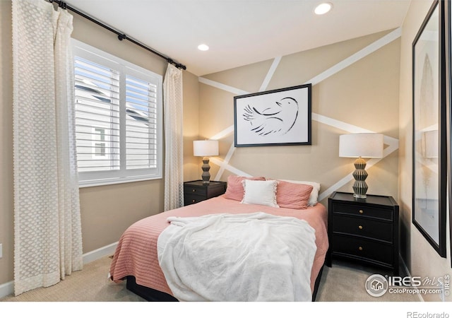 bedroom featuring light carpet