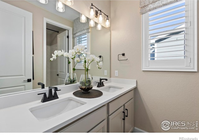 bathroom with vanity and a wealth of natural light