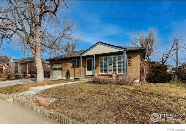 ranch-style home with a garage and a front yard