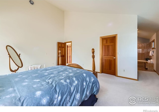 bedroom with light carpet and high vaulted ceiling