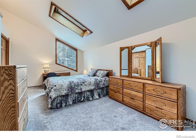 bedroom featuring light carpet and vaulted ceiling