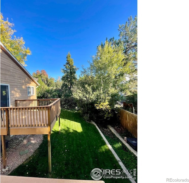 view of yard featuring a wooden deck