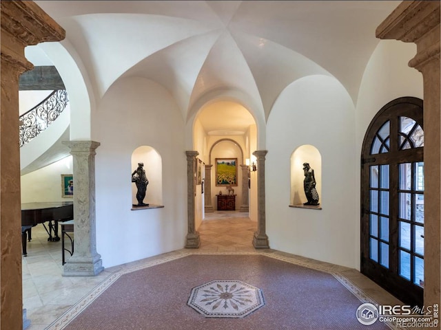 9200 Old Flowers Rd, Bellvue, CO 80512 - hallway with inlaid floor details, ornate columns, and a high ceiling