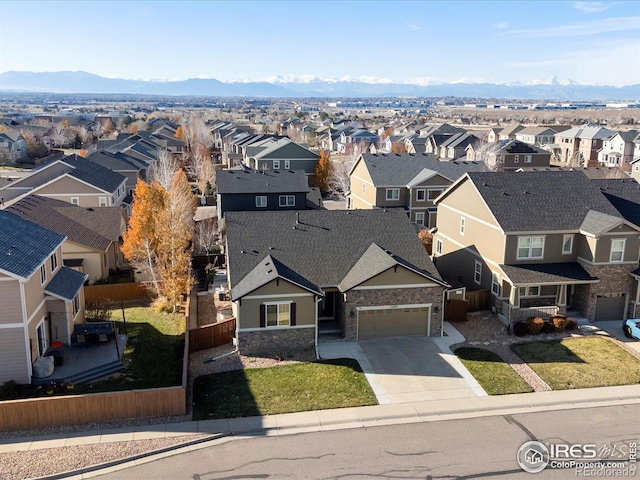 birds eye view of property featuring a mountain view