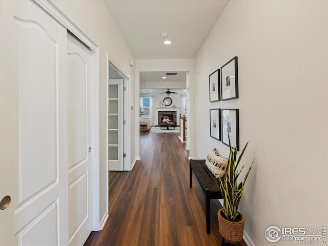 hallway with dark hardwood / wood-style floors