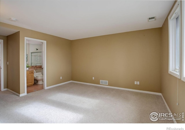 unfurnished room with carpet flooring