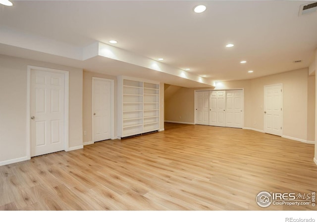 basement featuring light hardwood / wood-style flooring