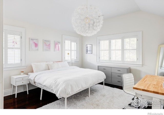 bedroom featuring vaulted ceiling and wood finished floors