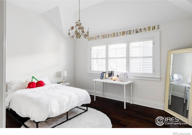 bedroom featuring hardwood / wood-style flooring, vaulted ceiling, and baseboards