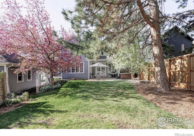 view of yard with a patio area and fence