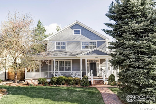 view of front of house featuring a porch and a front lawn