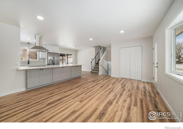 unfurnished living room with light wood-type flooring