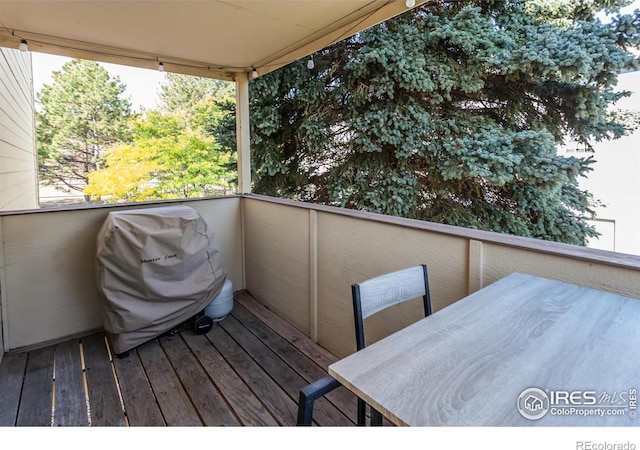 wooden terrace featuring grilling area