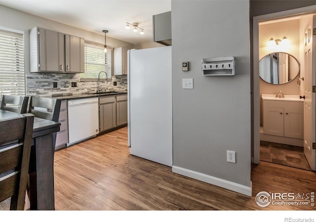 kitchen with pendant lighting, sink, refrigerator, gray cabinetry, and white dishwasher