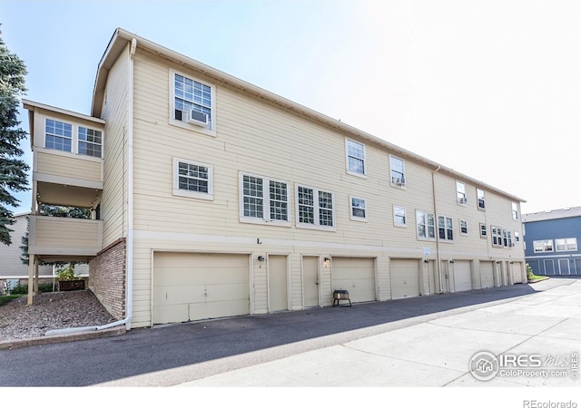 back of property with a garage