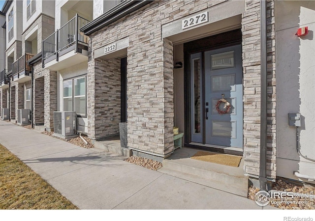 entrance to property featuring central AC unit