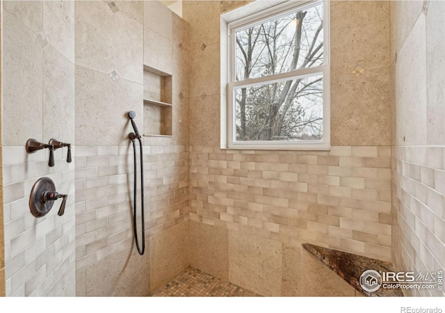 bathroom featuring tiled shower
