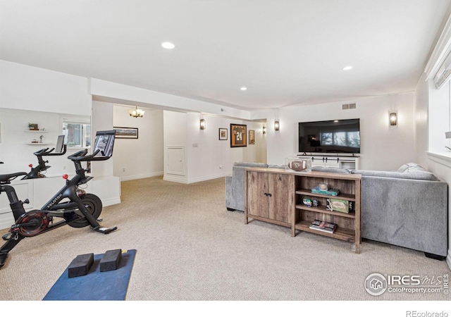 workout area featuring light carpet and recessed lighting