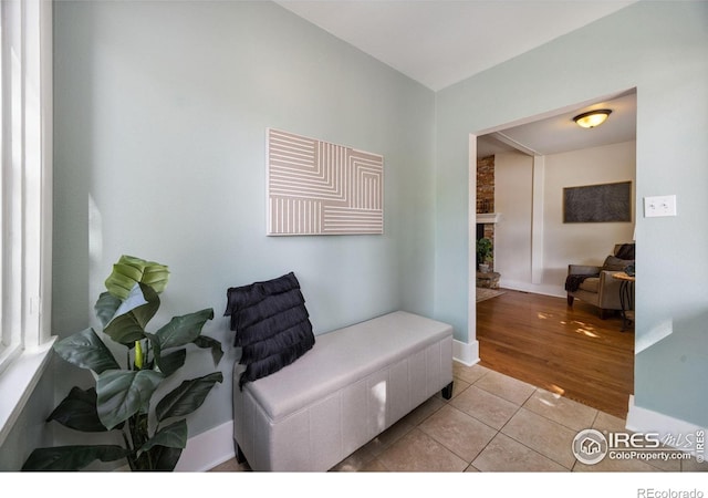 sitting room featuring light tile patterned flooring