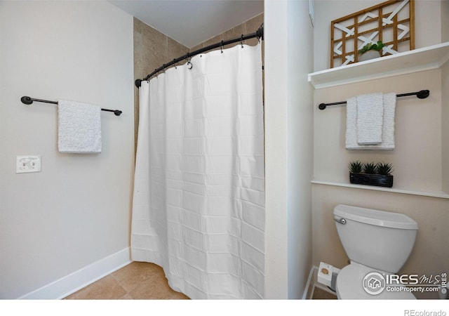 bathroom with toilet, tile patterned floors, and walk in shower