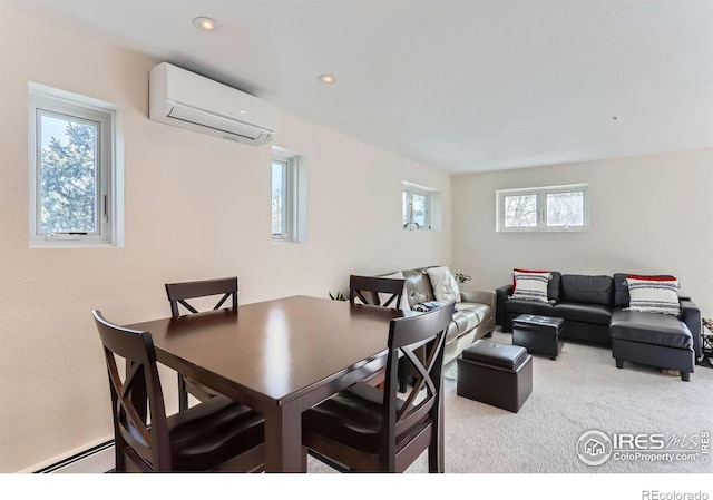 dining space with a wall mounted air conditioner, light colored carpet, and a baseboard heating unit