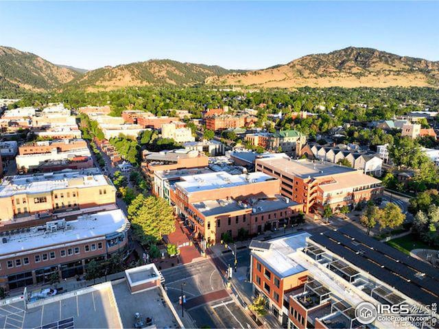 birds eye view of property with a mountain view