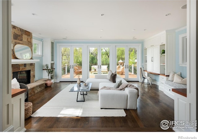 interior space with french doors and a fireplace