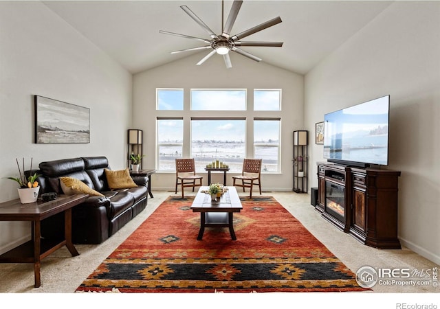 carpeted living room featuring high vaulted ceiling