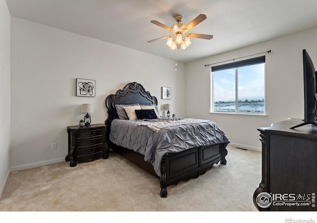 bedroom featuring ceiling fan and light colored carpet