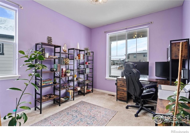 home office with light colored carpet