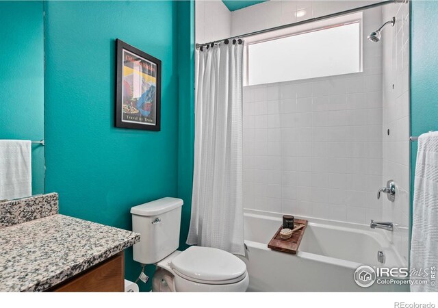 full bathroom with shower / bath combo, vanity, and toilet