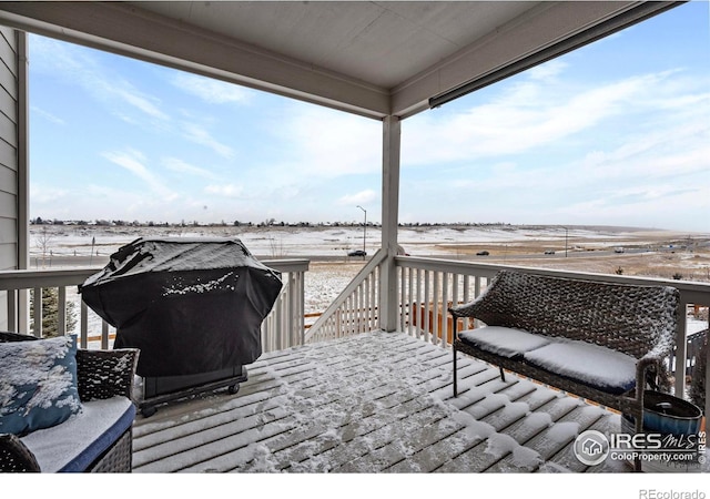 view of snow covered deck