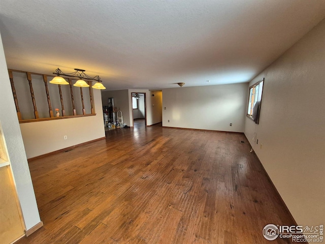 unfurnished living room with wood-type flooring