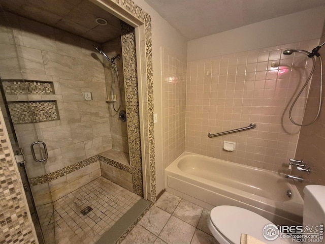 bathroom featuring tile patterned flooring and toilet