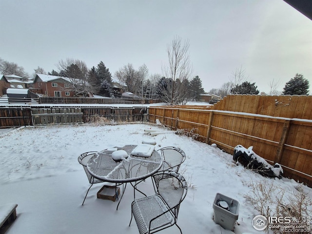 view of snow covered patio